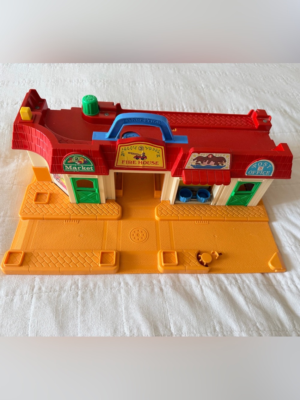 Vintage 1980s Fisher-Price Red Fire Hous with Blue Handle and Green Doors